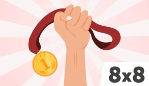 Person holding up a gold medal