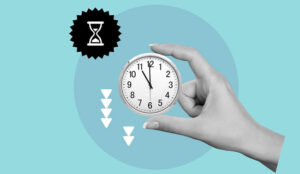 Reduce time concept with hand holding clock and down arrows