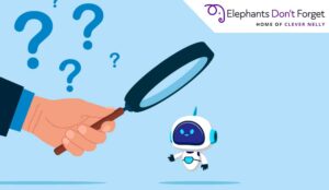 Hand holding a magnifying glass with a robot on it