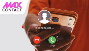 Close up of hand holding a smartphone with incoming call interface on the screen.