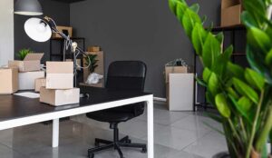 Office move concept with chair and boxes
