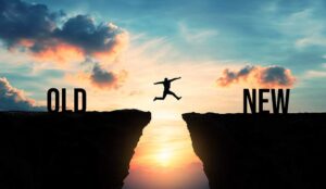 Person jumping from old to new