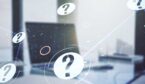 Question marks overlaid over laptop
