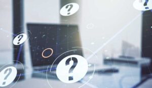 Question marks overlaid over laptop