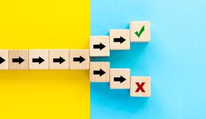 Successful pathway concept with blocks with arrows splitting to tick and cross